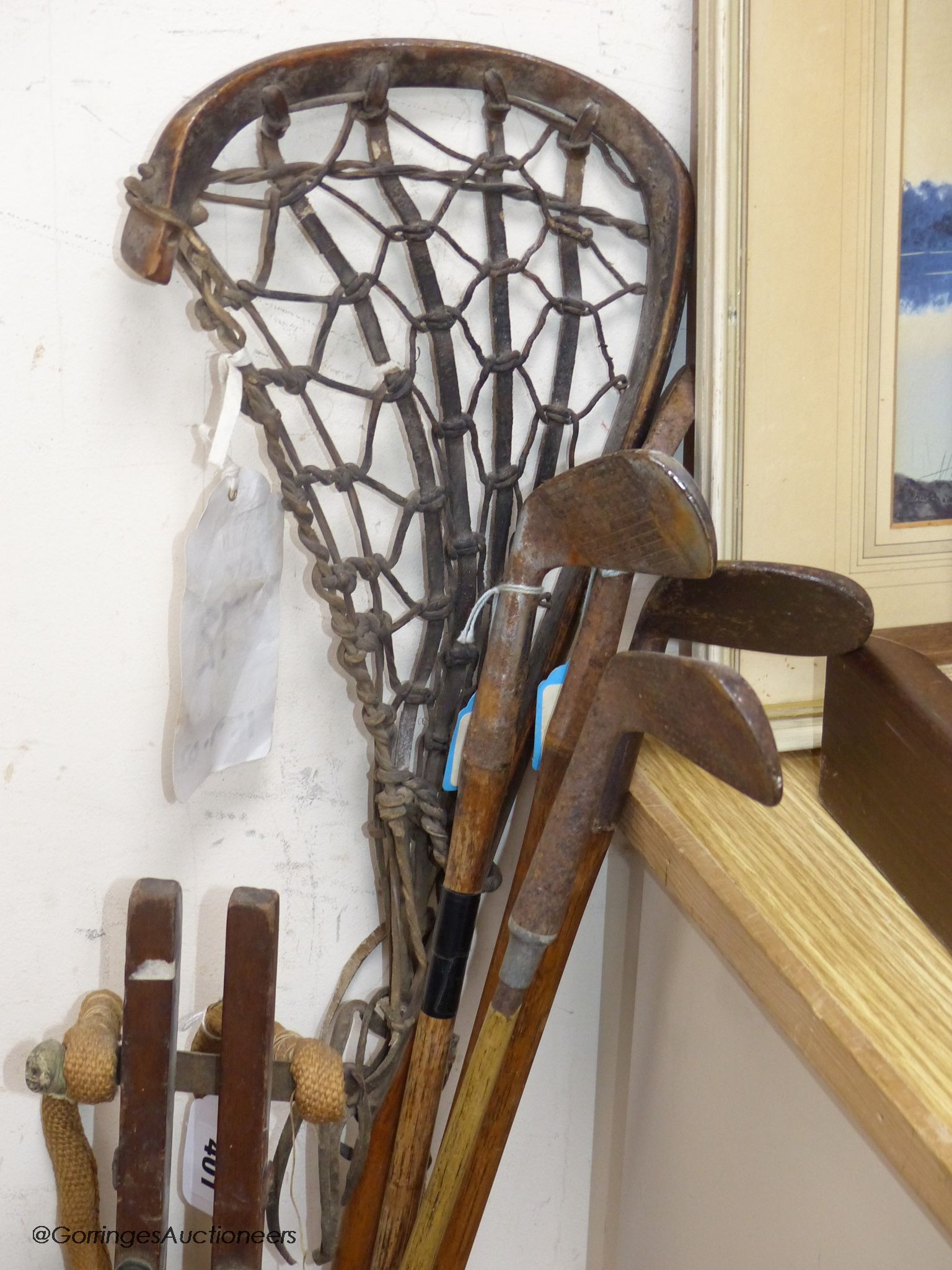 A collection of vintage golf clubs, three hickory shaft and golf bag with folding stand